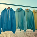 juergen.pirecki.giefing_a_lot_of_hoodies_hanging_on_a_clothes_r_9d262f6c-6fcd-48b1-8348-b49bc9f478b9